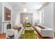 Elegant living room with neutral palette and connecting access to dining space beyond at 155 Wentworth St # A, Charleston, SC 29401