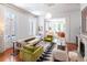 Bright living area with views into bedroom and dining areas, modern furnishings, and hardwood floors at 155 Wentworth St # A, Charleston, SC 29401