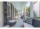 Welcoming porch with stylish seating options, perfect for enjoying the weather and the neighborhood views at 155 Wentworth St # A, Charleston, SC 29401