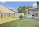A well maintained backyard with a seating area, grill, and screened in porch at 157 Tyger St, Summerville, SC 29485