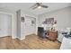 Comfortable home office features wood floors, a ceiling fan, and custom decor at 157 Tyger St, Summerville, SC 29485
