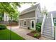 Exterior view of backyard with stairs to a deck at 1629 Ware Bottom Ln, Mount Pleasant, SC 29464