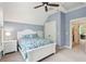 Charming bedroom features a ceiling fan, ensuite bathroom access, and a double door closet at 1629 Ware Bottom Ln, Mount Pleasant, SC 29464