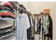 Walk in closet with shelving and rods filled with folded and hanging clothing at 1629 Ware Bottom Ln, Mount Pleasant, SC 29464