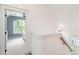 Hallway leading to a bedroom with a ceiling fan and a window with shutters at 1629 Ware Bottom Ln, Mount Pleasant, SC 29464