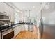 Well-lit kitchen featuring granite countertops, modern stainless steel appliances, and hardwood floors at 1629 Ware Bottom Ln, Mount Pleasant, SC 29464