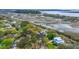 Aerial shot showcasing the neighborhood near a meandering river and a waterway at 1673 Mcclain St, Charleston, SC 29407