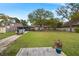 The backyard has large grassy areas, a boat, and a private fenced area at 1673 Mcclain St, Charleston, SC 29407