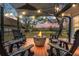 Cozy backyard featuring a fire pit surrounded by comfortable seating, great for entertaining at 1673 Mcclain St, Charleston, SC 29407