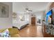 Spacious bedroom features hardwood floors, neutral walls, ceiling fan and private deck access at 1673 Mcclain St, Charleston, SC 29407