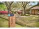 Charming brick home showcasing its well-maintained lawn and delightful curb appeal at 1673 Mcclain St, Charleston, SC 29407