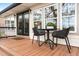 Charming outdoor patio featuring a cozy table and chairs, perfect for enjoying morning coffee or evening sunsets at 1673 Mcclain St, Charleston, SC 29407