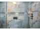 Close-up of a modern shower with luxurious tile, built-in niche, and contemporary fixtures at 1673 Mcclain St, Charleston, SC 29407