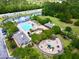 Aerial view of the community pool, playground, and recreational area surrounded by lush landscaping at 1678 William Hapton Way, Mount Pleasant, SC 29466