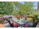 Back deck featuring an outdoor dining area with a BBQ grill at 1678 William Hapton Way, Mount Pleasant, SC 29466