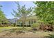 Well-maintained backyard with lush green lawn, mature trees, and partially shaded area to enjoy outdoor living at 1678 William Hapton Way, Mount Pleasant, SC 29466