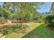 Large backyard featuring a playground and a wooden fence at 1678 William Hapton Way, Mount Pleasant, SC 29466