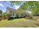 Backyard featuring a deck, mature trees, and lush green grass at 1678 William Hapton Way, Mount Pleasant, SC 29466