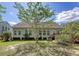Backyard featuring a deck, mature trees, and lush green grass at 1678 William Hapton Way, Mount Pleasant, SC 29466