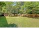 Spacious backyard featuring a swing set and a wooden fence at 1678 William Hapton Way, Mount Pleasant, SC 29466