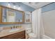 Bathroom featuring a granite countertop vanity and shower-tub combo at 1678 William Hapton Way, Mount Pleasant, SC 29466