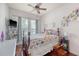 Comfortable bedroom featuring a ceiling fan, wood floors, and a cozy bed at 1678 William Hapton Way, Mount Pleasant, SC 29466