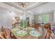 Elegant dining room featuring a wooden table, stylish place settings, and an open layout to the living areas at 1678 William Hapton Way, Mount Pleasant, SC 29466