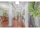 A spacious foyer with gleaming hardwood floors leads to the dining and living areas at 1678 William Hapton Way, Mount Pleasant, SC 29466