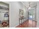 Welcoming foyer with hardwood floors, a coat closet, and a view to the front porch at 1678 William Hapton Way, Mount Pleasant, SC 29466