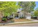 Inviting home with a well-maintained lawn, attached garage, covered porch, and attractive landscaping at 1678 William Hapton Way, Mount Pleasant, SC 29466