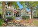 Charming home with a welcoming front porch, rocking chairs, and an American flag at 1678 William Hapton Way, Mount Pleasant, SC 29466