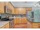 Modern kitchen featuring stainless steel appliances, granite countertops, and ample cabinet space at 1678 William Hapton Way, Mount Pleasant, SC 29466
