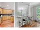 Well-designed kitchen and breakfast bar area with granite countertops, wooden cabinetry, and stainless steel appliances at 1678 William Hapton Way, Mount Pleasant, SC 29466