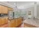 Spacious kitchen featuring stainless steel appliances, granite countertops, a center island, and an adjacent dining area at 1678 William Hapton Way, Mount Pleasant, SC 29466