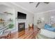 Inviting living space with a fireplace, built-in shelving, hardwood floors, and plenty of natural light at 1678 William Hapton Way, Mount Pleasant, SC 29466