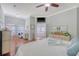 Spacious main bedroom with ensuite bath featuring a soaking tub, dual vanities, and decorative lighting at 1678 William Hapton Way, Mount Pleasant, SC 29466