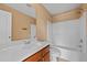 Bathroom features a vanity, toilet, and a shower-tub combo with white tile, all in a clean and inviting space at 1825 Brittlebush Ln, Johns Island, SC 29455