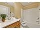 Full bathroom with a tub, toilet, vanity, and sink with ample lighting at 1825 Brittlebush Ln, Johns Island, SC 29455