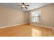 Spacious bedroom with hardwood floors, a ceiling fan, and natural light at 1825 Brittlebush Ln, Johns Island, SC 29455