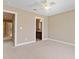 Neutral carpeted bedroom with neutral paint and a bathroom view at 1825 Brittlebush Ln, Johns Island, SC 29455