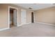 Neutral-toned bedroom featuring plush carpeting, multiple closets, and an ensuite bathroom, perfect for relaxation at 1825 Brittlebush Ln, Johns Island, SC 29455