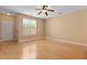 Bright bedroom with hardwood floors, a ceiling fan, and a large window at 1825 Brittlebush Ln, Johns Island, SC 29455