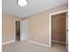 Cozy carpeted bedroom with neutral paint, white trim, closet, and interior doors at 1825 Brittlebush Ln, Johns Island, SC 29455