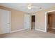 Bedroom with carpet, neutral paint and view into bathroom with walk in shower at 1825 Brittlebush Ln, Johns Island, SC 29455