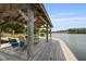 Relaxing view from a covered dock with comfortable seating overlooking tranquil waters and surrounding community scenery at 1825 Brittlebush Ln, Johns Island, SC 29455