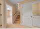 Upstairs hallway with laundry area and access to the bedrooms via carpeted staircase at 1825 Brittlebush Ln, Johns Island, SC 29455