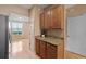 Stylish kitchen featuring granite countertops, wooden cabinets, and stainless steel refrigerator at 1825 Brittlebush Ln, Johns Island, SC 29455