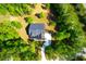 Aerial view of a home nestled among lush greenery and a long driveway at 202 Countryside Way, Summerville, SC 29483