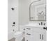 Modern bathroom featuring white cabinetry, a sleek mirror, and a shower-tub combo at 202 Countryside Way, Summerville, SC 29483