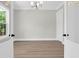 Bright bedroom featuring neutral walls, hardwood floors, a modern chandelier, and natural light at 202 Countryside Way, Summerville, SC 29483